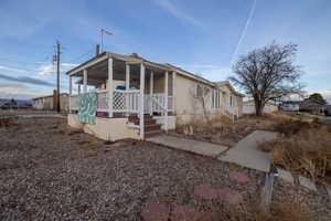 View of front of house with covered porch