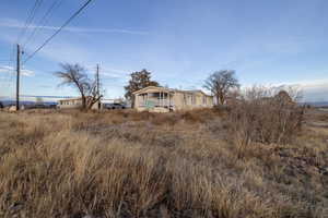 View of yard featuring covered porch