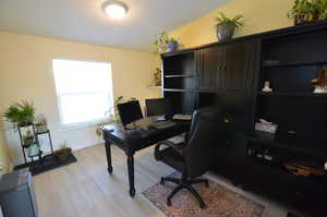 Home office featuring light wood-type flooring