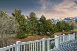 Golf Course and Mountain view from backyard deck at dusk with a mountain view