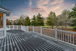 Golf Course and Mountain view from backyard deck at dusk with a mountain view