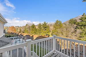 Private Balcony with golf course and mountain views off of the master suite