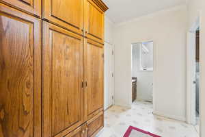 Main floor mud room from garage with access to powder half bathroom and laundry room