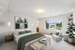 Freshly painted and carpeted bedroom with large windows, storage seat, built in shelves and desk