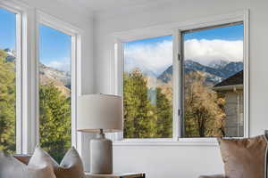 Mountain views from the freshly carpeted and painted family room with floor to ceiling windows, walk out to deck, stone fireplace and built ins.