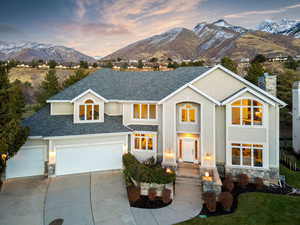 View of front facade featuring a mountain view and a garage