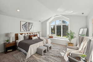 Freshly carpeted and painted guest bedroom with lofted ceiling and large window seat and west facing windows