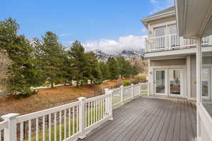 Wooden deck with a mountain and golf course views