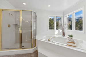 Freshly painted and carpeted master bathroom with bathtub and extraordinary views