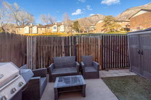 View of patio / terrace with area for grilling and a mountain view