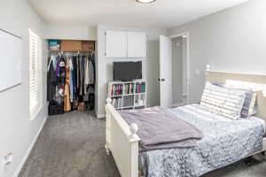 Bedroom featuring a closet and carpet