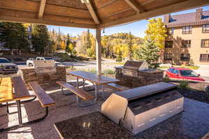 View of patio with a gazebo, area for grilling, and grilling area