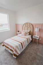 Picture is of model home. View of carpeted bedroom