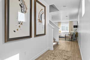 Hallway featuring light wood-type flooring