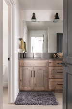 Bathroom featuring vanity and toilet