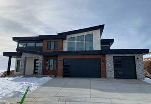 Contemporary home featuring a garage