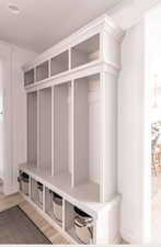 Mudroom with light hardwood / wood-style flooring