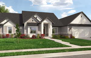 View of front of house with a garage and a front yard