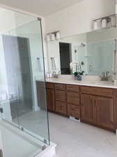 Bathroom with vanity and an enclosed shower