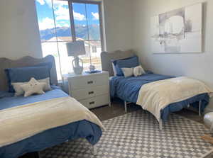 Carpeted bedroom featuring a mountain view