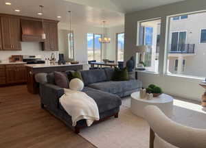 Living room featuring a chandelier and dark hardwood / wood-style floors
