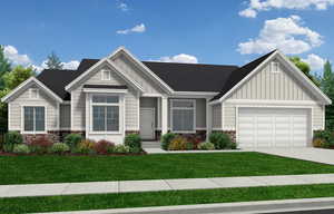 Craftsman inspired home with a front lawn and a garage