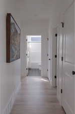 Hallway featuring light wood-type flooring