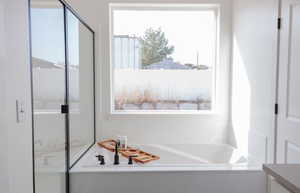 Bathroom with vanity and a tub