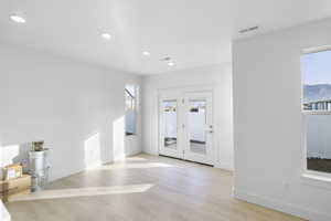 Entrance foyer featuring light hardwood / wood-style flooring