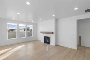 Unfurnished living room featuring light hardwood / wood-style flooring