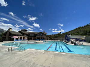 View of pool with a water slide