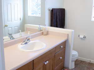 Bathroom featuring vanity and toilet