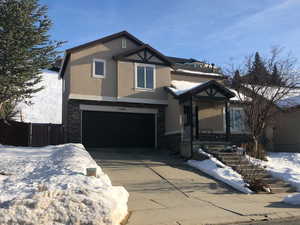 View of front of property with a garage