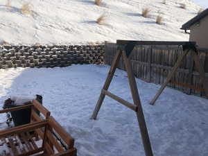 View of yard covered in snow