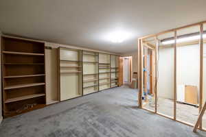 Large bedroom with spacious closet construction framed in