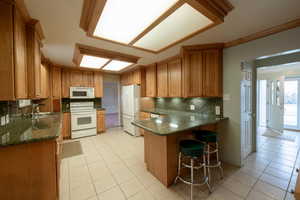 Kitchen with granite countertops and updated cabinetry