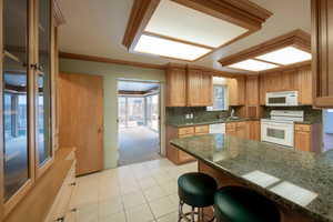 Kitchen with granite countertops and updated cabinetry