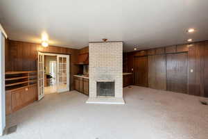 Light, open family room off kitchen with extra cooktop, fireplace, closet space and walkout slider to backyard patio