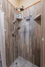 Bathroom featuring a shower with shower curtain