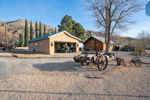 Exterior space featuring an outbuilding, a mountain view, and a garage