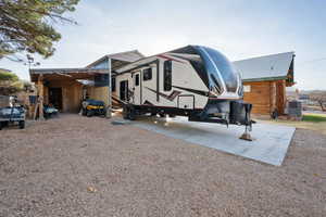 View of front of property with a carport