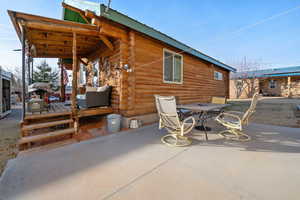 View of patio with a wooden deck