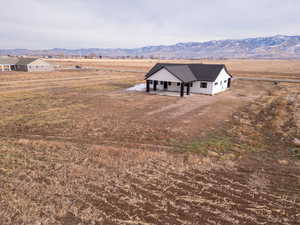 Drone / aerial view featuring a mountain view and a rural view