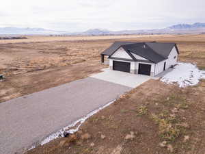 Birds eye view of property featuring a mountain view and a rural view