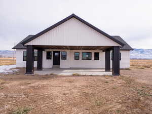 View of front facade featuring a mountain view and a porch