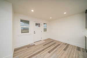 Foyer featuring light hardwood / wood-style flooring and plenty of natural light