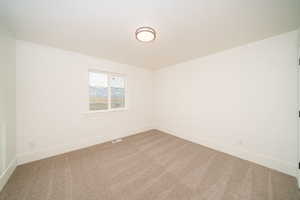 Unfurnished room featuring carpet floors