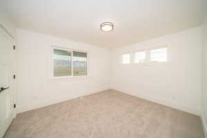 View of carpeted spare room