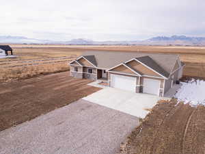 View of front facade with a mountain view and a garage