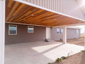 View of patio with a carport